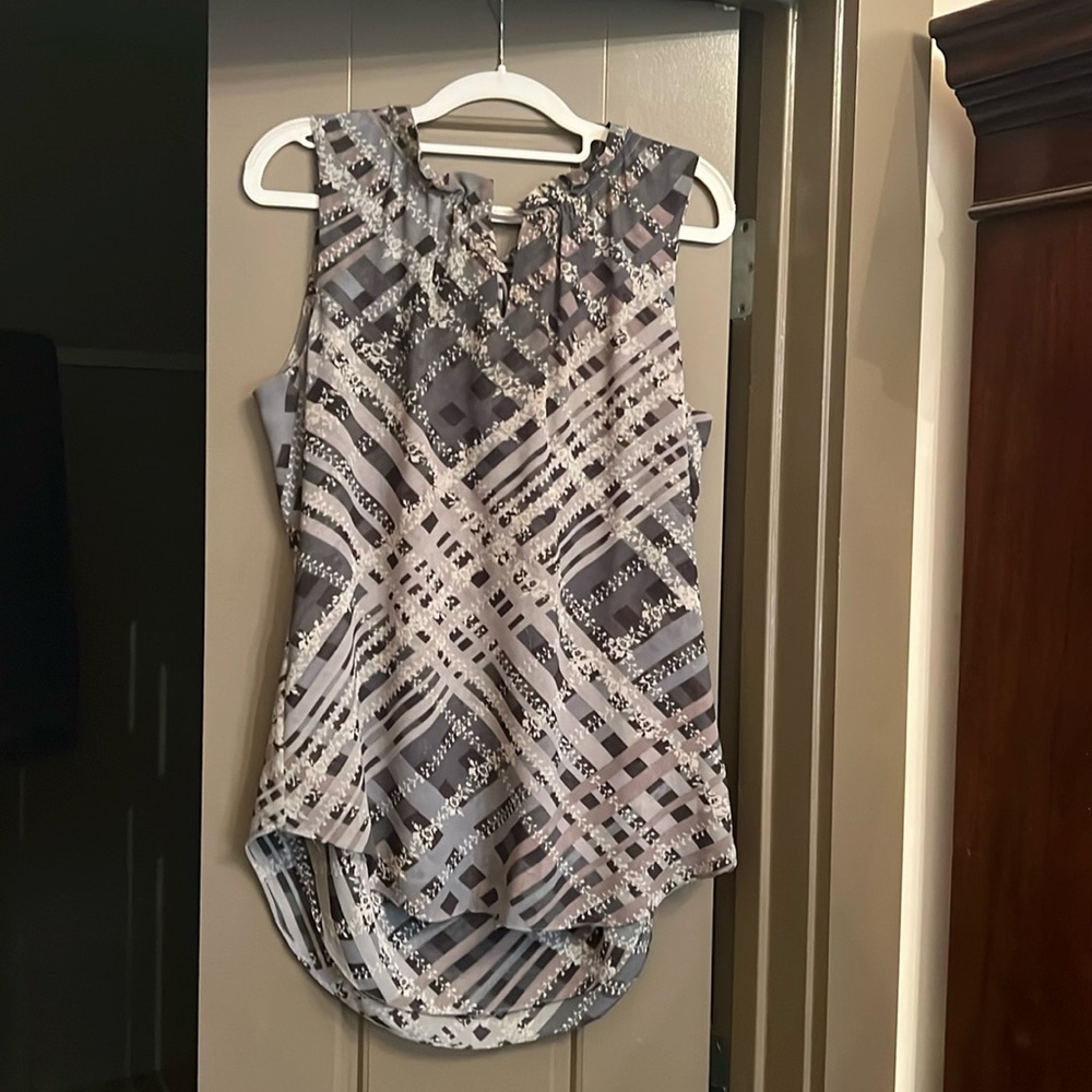 Cabi blue/gray sleeveless top is ruffled at the keyhole neckline, ties in back